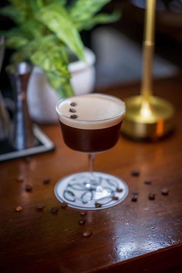 Espresso martini scattered with coffee beans